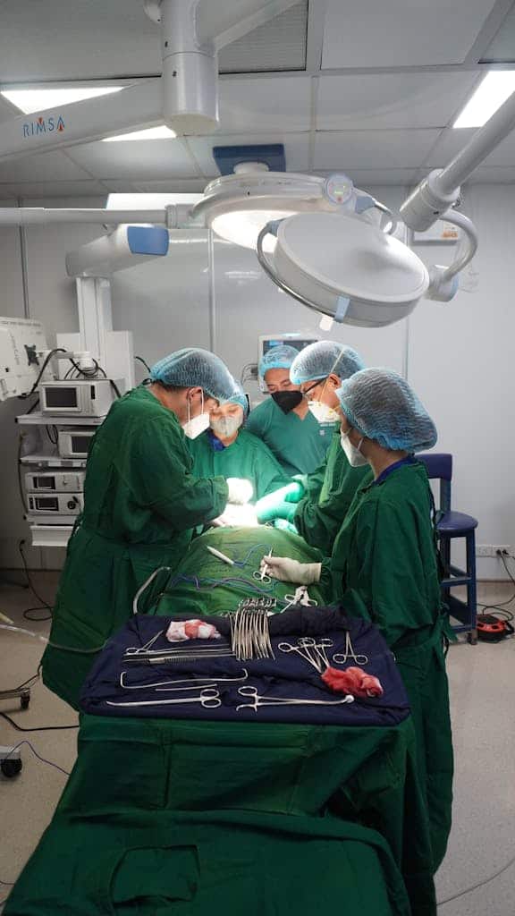 Doctors performing surgery with precision in a hospital operating room.